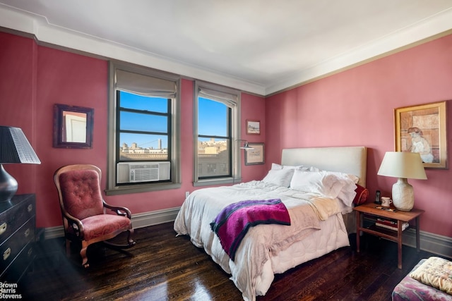 bedroom with cooling unit, dark hardwood / wood-style flooring, and crown molding