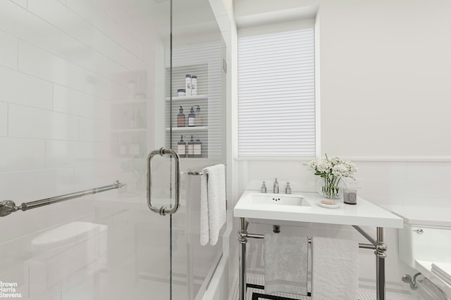 bathroom featuring a sink and a shower stall