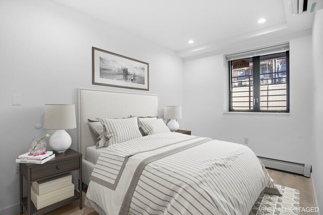 1433 E 52nd St Unit 1A, New York City, NY 11234 - bedroom featuring a baseboard radiator, recessed lighting, and baseboards