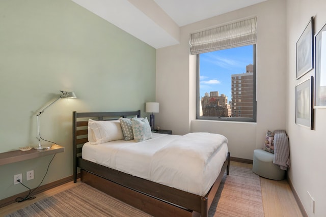 88 Lexington Ave Unit 1506, New York City, NY 10016 - bedroom featuring wood finished floors and a view of city