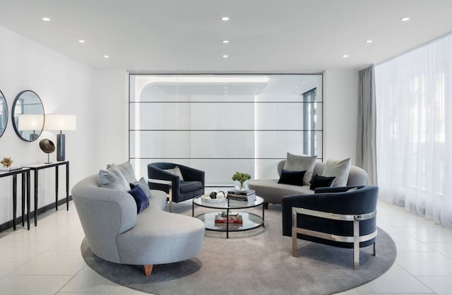 tiled living room featuring a wall of windows