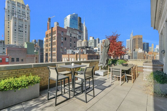 88 Lexington Ave Unit 1506, New York City, NY 10016 - view of patio with a view of skyline and outdoor dining space