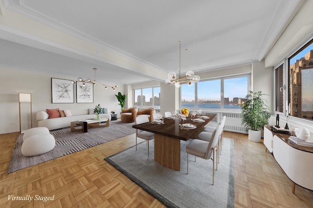 dining area with ornamental molding, radiator heating unit, and an inviting chandelier