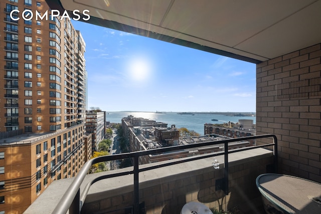 balcony with a city view and a water view