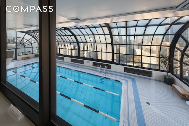 view of swimming pool featuring a view of city