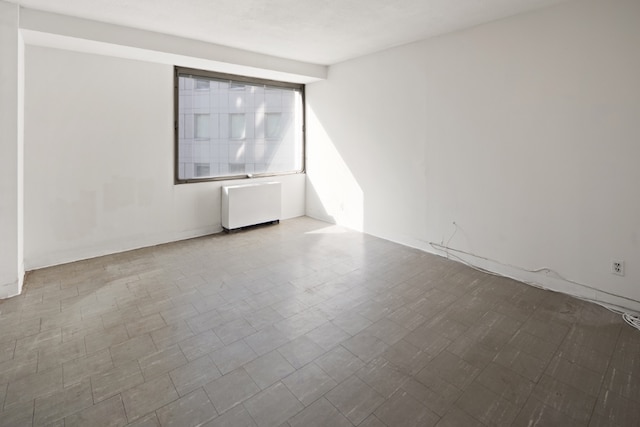 empty room featuring radiator