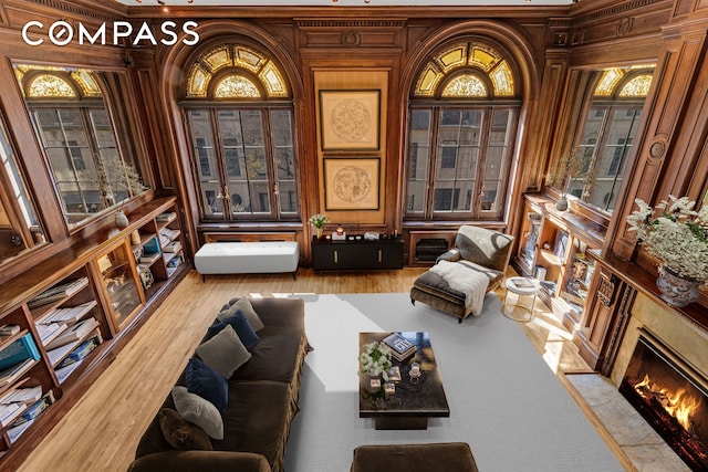 sitting room featuring wood finished floors and a high end fireplace