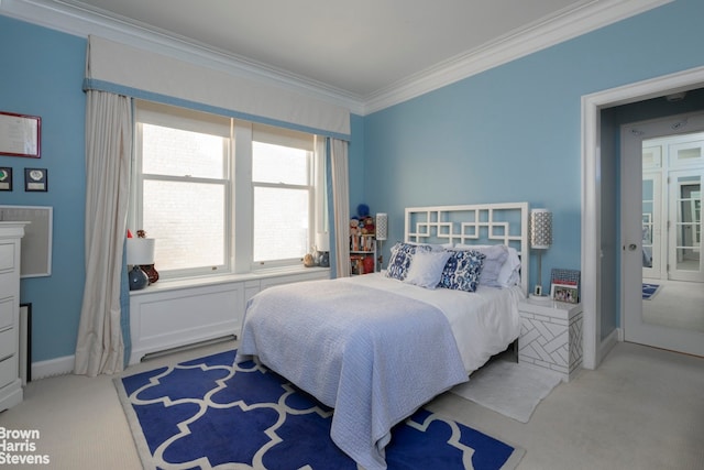 bedroom featuring crown molding and light carpet