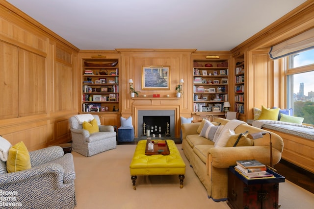 living room featuring built in shelves and a fireplace