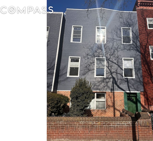 view of home's exterior with brick siding