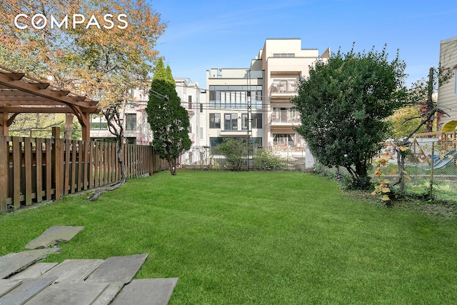 view of yard with fence and a pergola