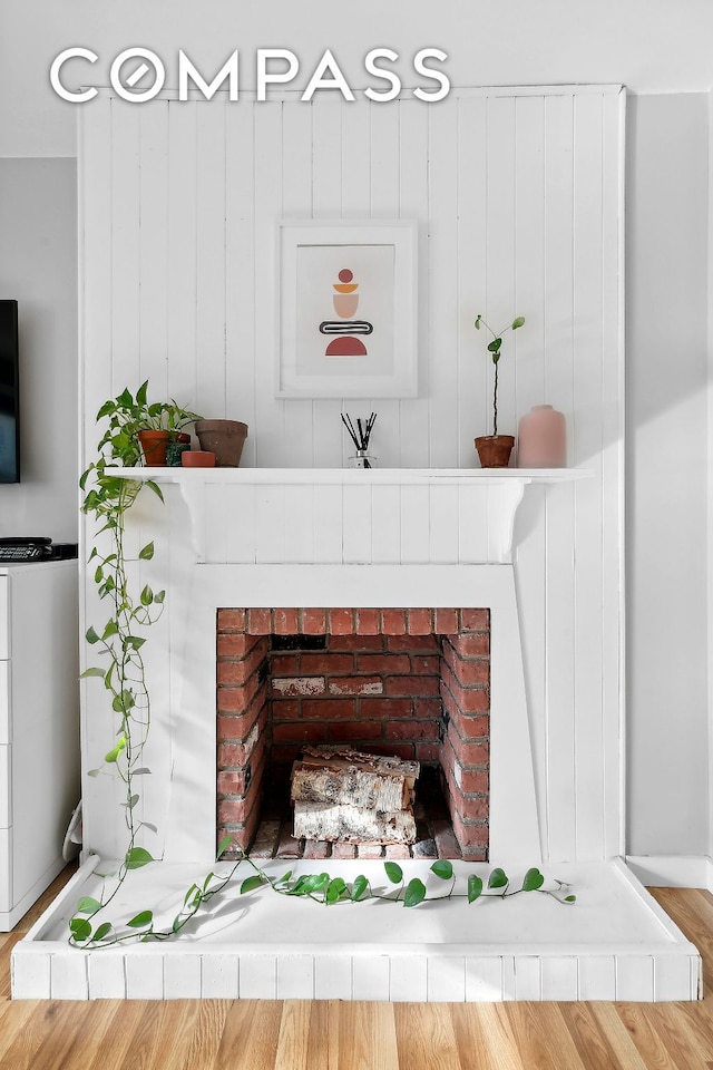 room details featuring a brick fireplace