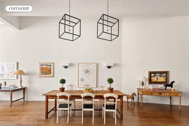 dining space with wood finished floors and visible vents