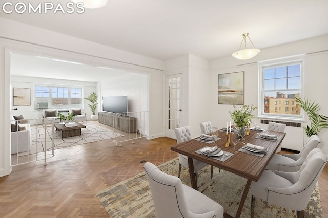 dining area with parquet flooring and radiator heating unit