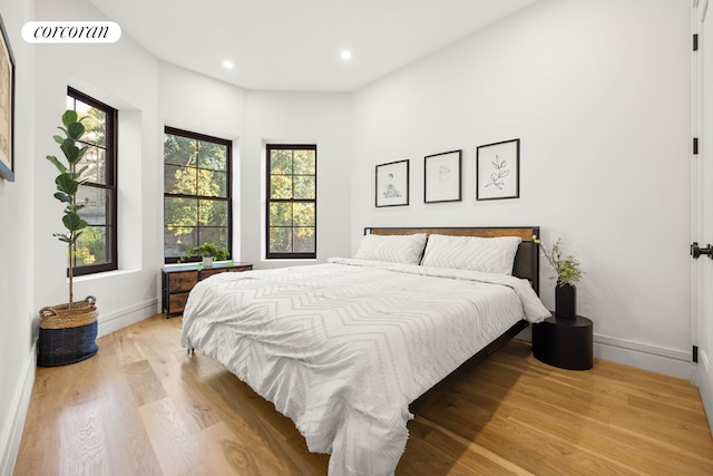 bedroom with visible vents, recessed lighting, light wood-style flooring, and baseboards