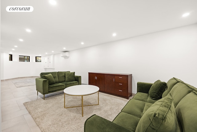 living room featuring recessed lighting, visible vents, and a wall unit AC