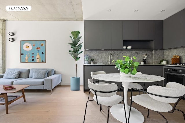 dining space with visible vents and light wood-style flooring