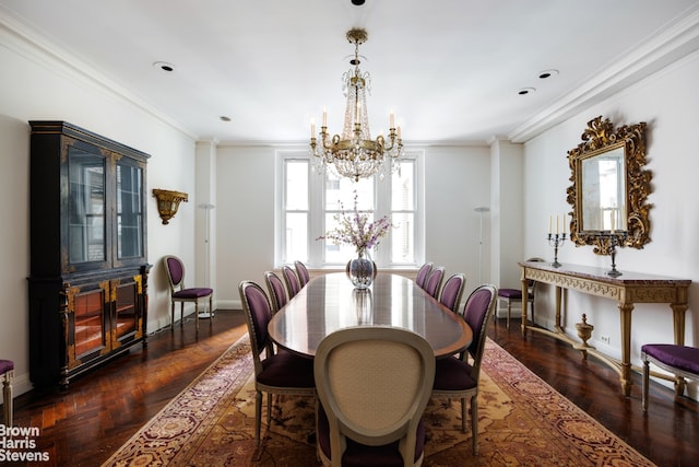 dining area featuring baseboards, a notable chandelier, and crown molding