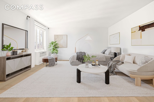 living room with radiator heating unit and wood finished floors