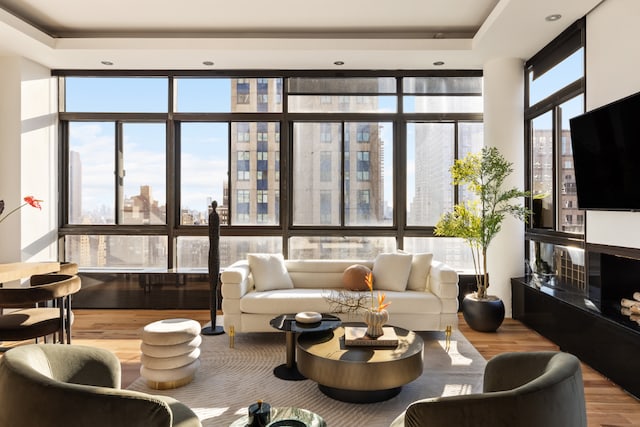 living room featuring hardwood / wood-style flooring and expansive windows