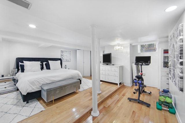 bedroom with hardwood / wood-style flooring