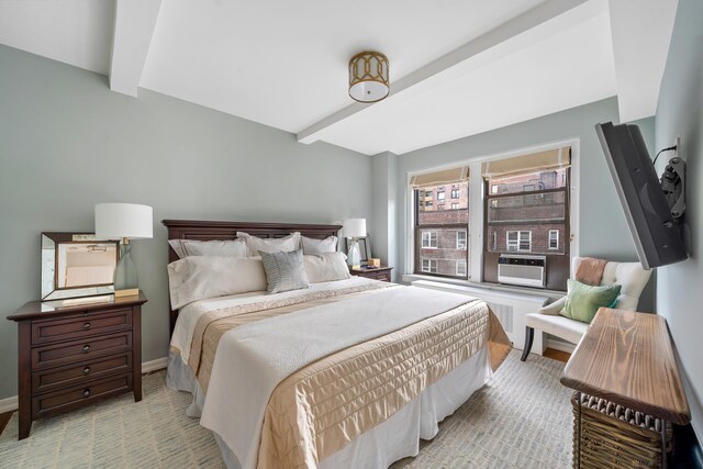 339 E 58th St Unit 7Cd, New York City, NY 10022 - bedroom featuring beam ceiling, baseboards, and cooling unit