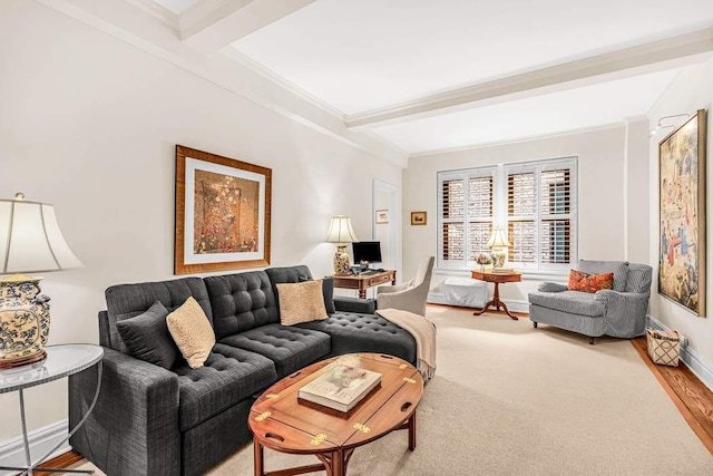 living room featuring beamed ceiling, wood-type flooring, and crown molding