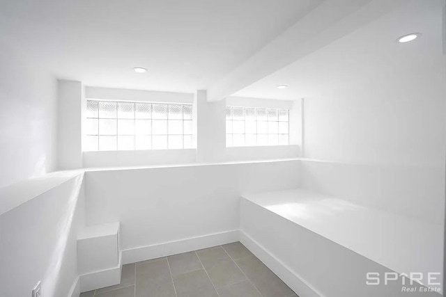 bathroom featuring tile patterned floors, recessed lighting, and baseboards