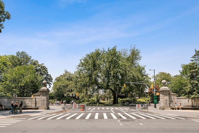 20 E 88th St Unit 2B, New York City, NY 10128 - view of asphalt road with street lights, traffic lights, traffic signs, and curbs