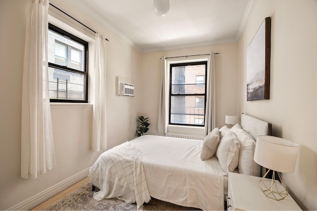 20 E 88th St Unit 2B, New York City, NY 10128 - bedroom featuring multiple windows, a wall mounted AC, crown molding, and wood finished floors