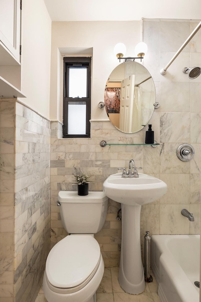 20 E 88th St Unit 2B, New York City, NY 10128 - bathroom featuring shower / bath combo with shower curtain, tile walls, and a wainscoted wall
