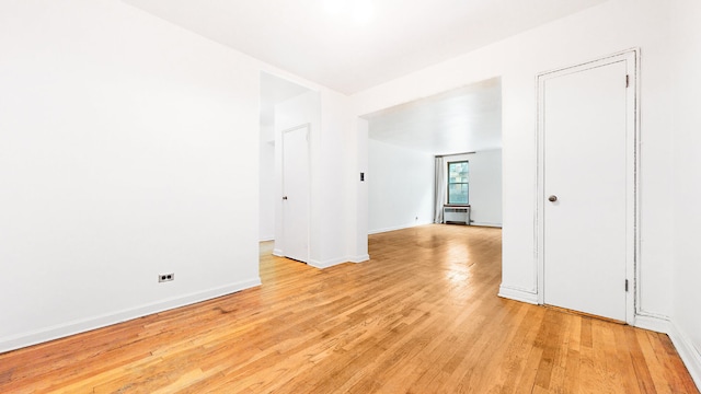 unfurnished room featuring light hardwood / wood-style floors