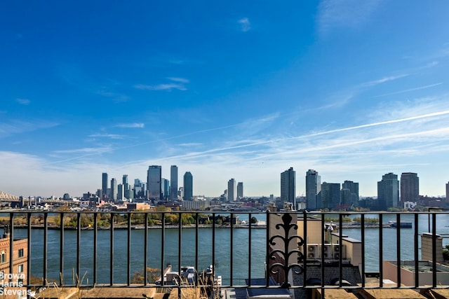 property's view of city featuring a water view