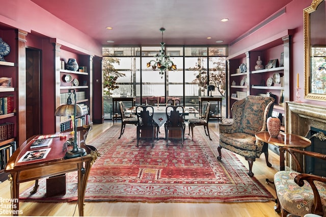 dining area with an inviting chandelier and wood finished floors