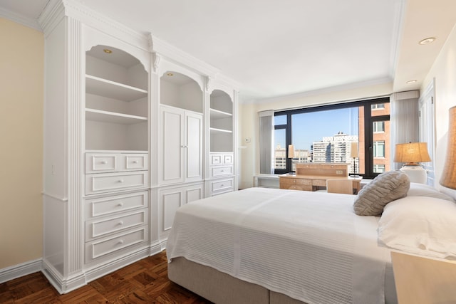 bedroom with baseboards, access to exterior, and crown molding