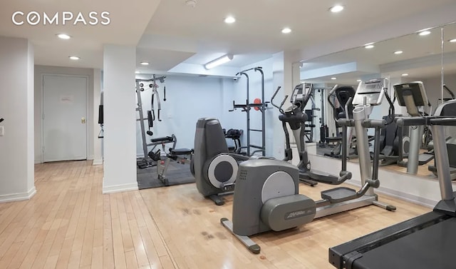 workout area featuring recessed lighting, baseboards, and hardwood / wood-style flooring