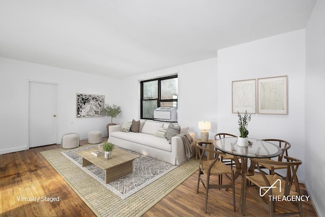 living room with baseboards, cooling unit, and dark wood-style flooring