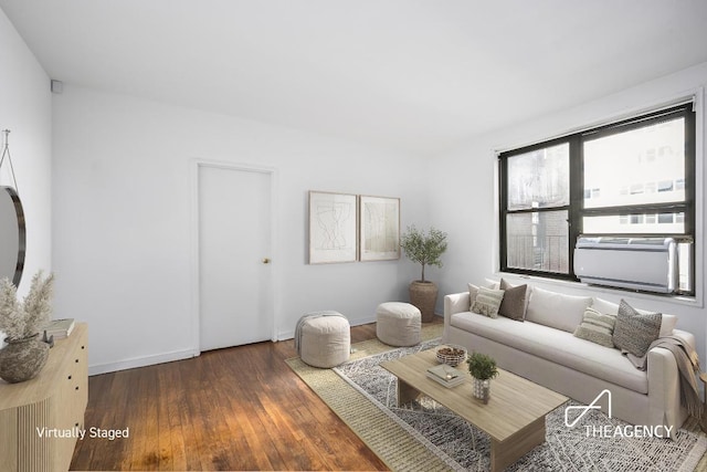 living room with baseboards and dark wood-type flooring