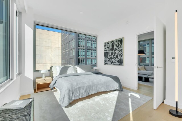 bedroom with light wood-type flooring