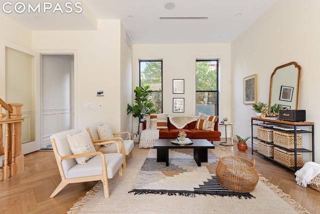 living room featuring light parquet flooring