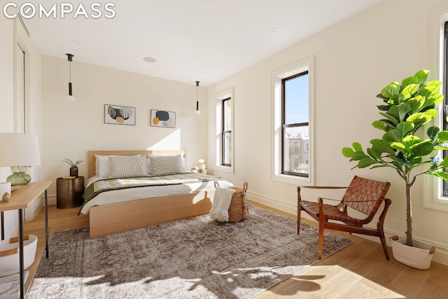 bedroom with wood-type flooring