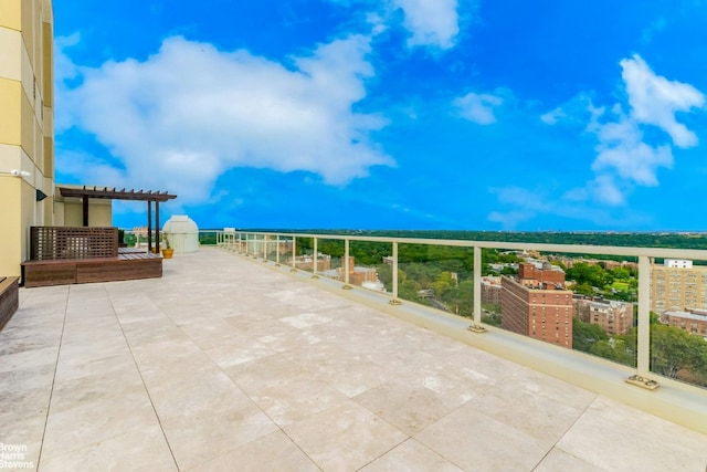 view of patio featuring a balcony and a pergola