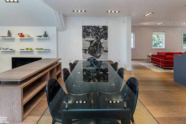 dining room featuring baseboards and wood finished floors