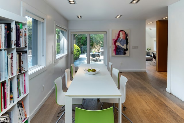 dining room with baseboards and wood finished floors