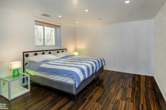 bedroom featuring dark wood-type flooring, visible vents, and recessed lighting