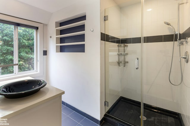 800 W 231st St, New York City, NY 10463 - bathroom with a shower stall, tile patterned floors, and vanity