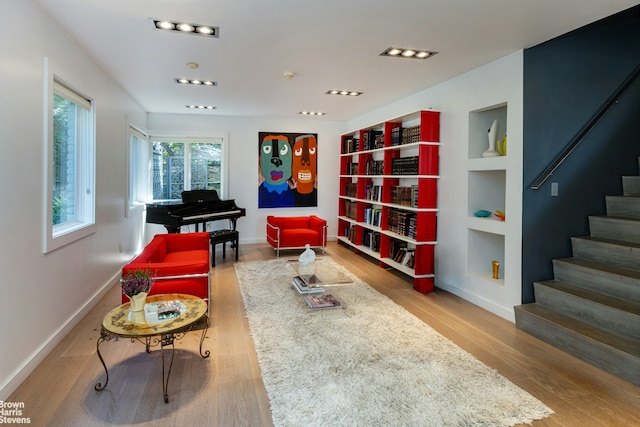 800 W 231st St, New York City, NY 10463 - living area featuring stairs, baseboards, wood finished floors, and built in features