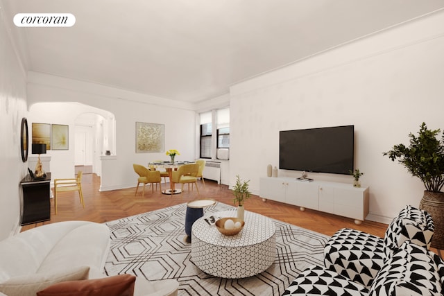 living room with light parquet flooring and ornamental molding