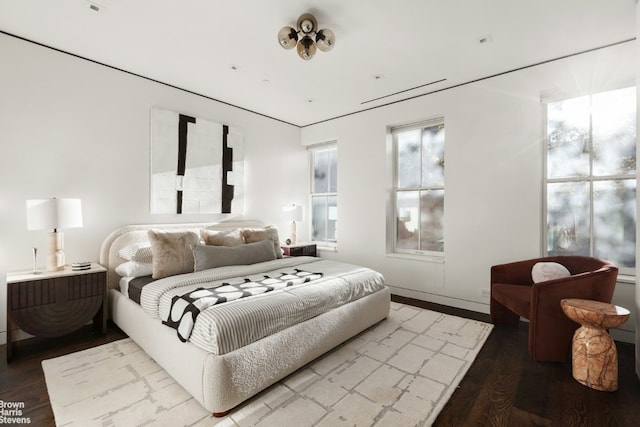 bedroom featuring wood finished floors