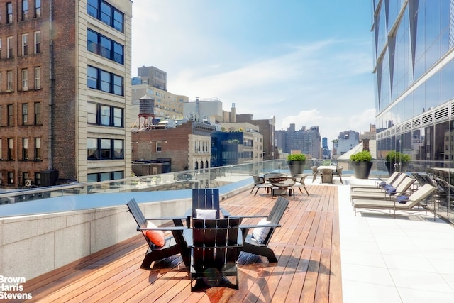 wooden terrace featuring a view of city